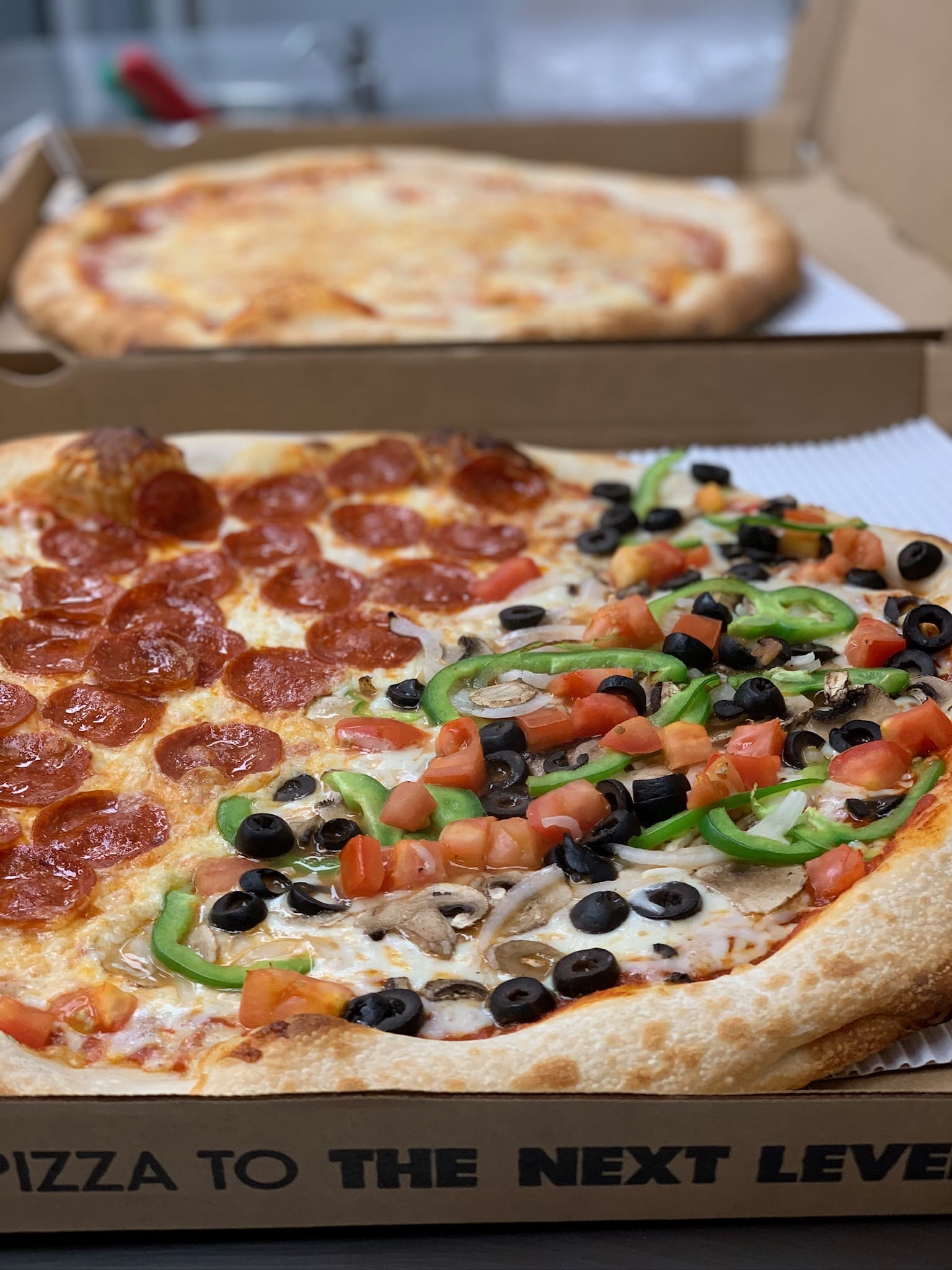 Uncut pizza in a box